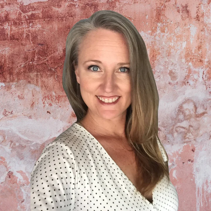 Amanda Foster smiling, in a white patterned blouse